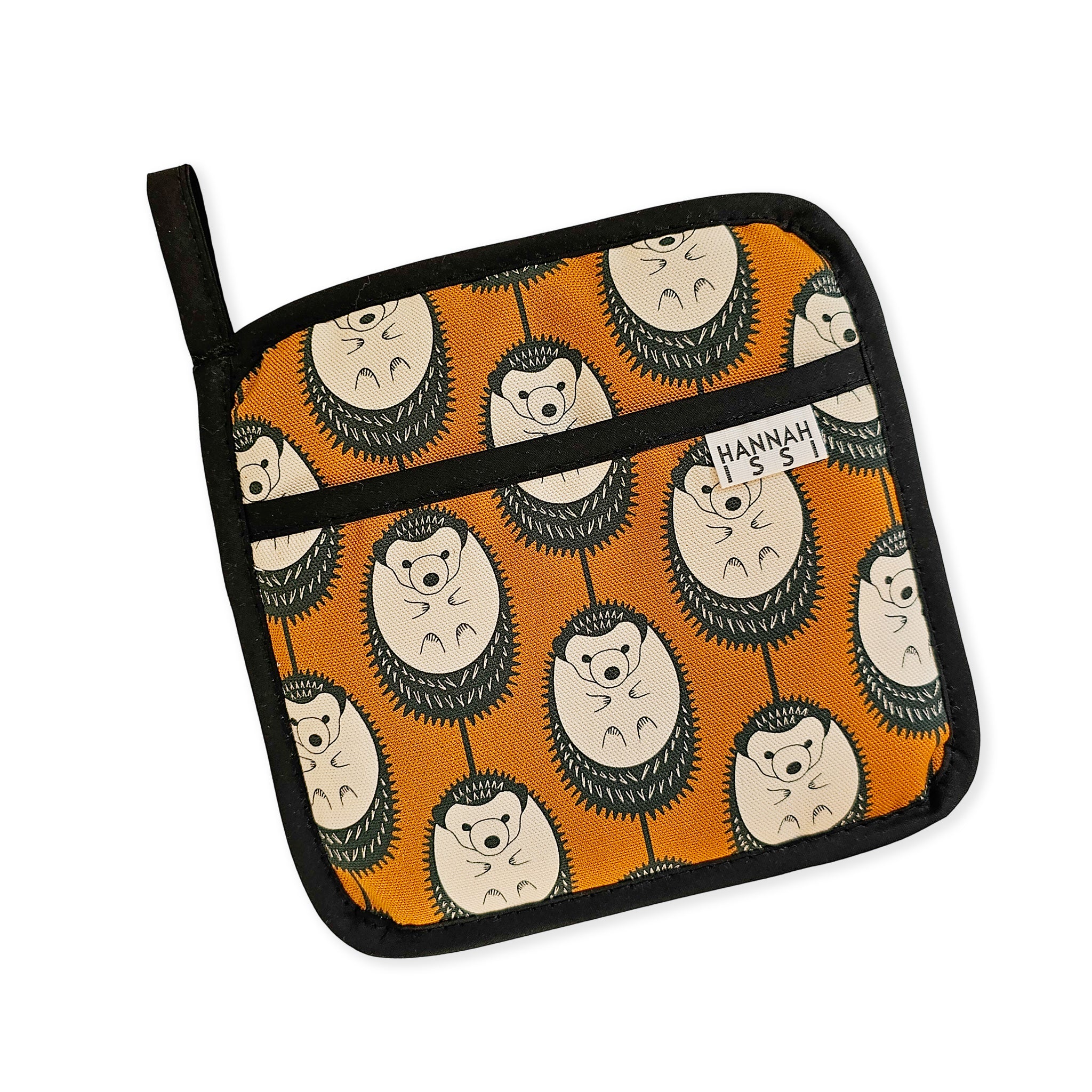Organic cotton Brown & White Hedgehog pot grab – heat-safe kitchen handle cover by Hannah Issi, handmade in the UK. Stylish and functional. Cut-out image with white background.