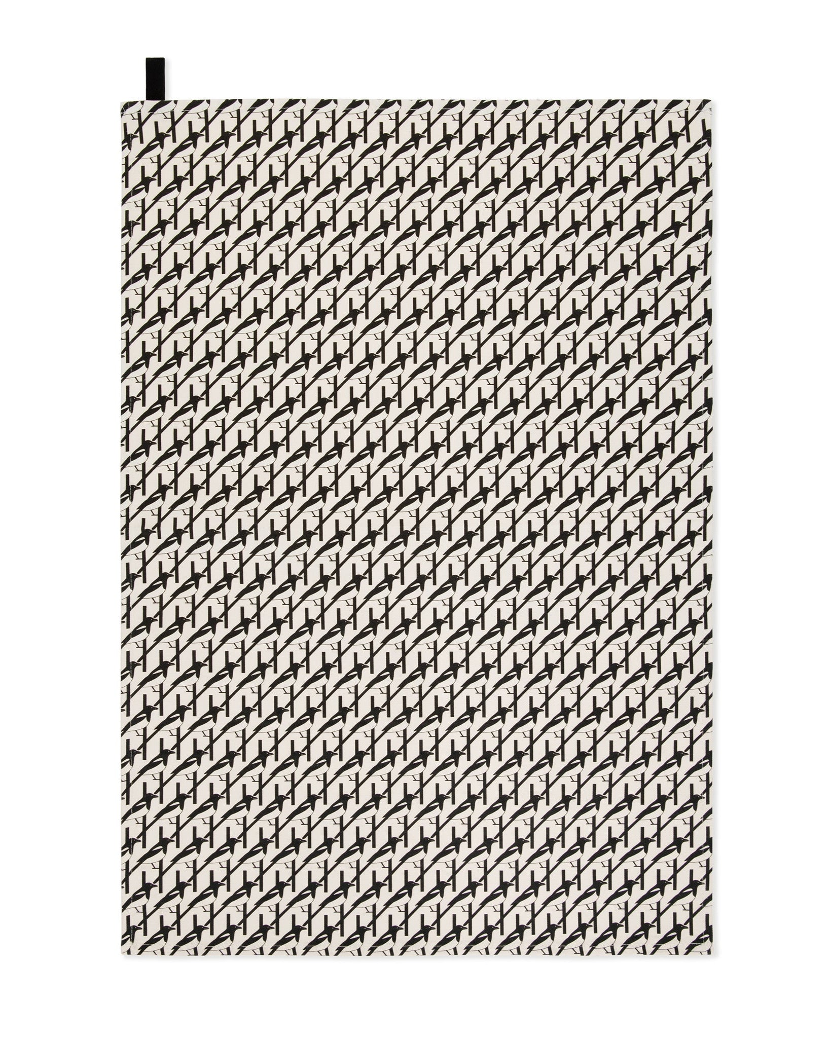 Organic cotton black and white magpie tea towel – designed by Hannah Issi and handmade in the UK. Stylish, sustainable kitchen linen - cut out image with white background.
