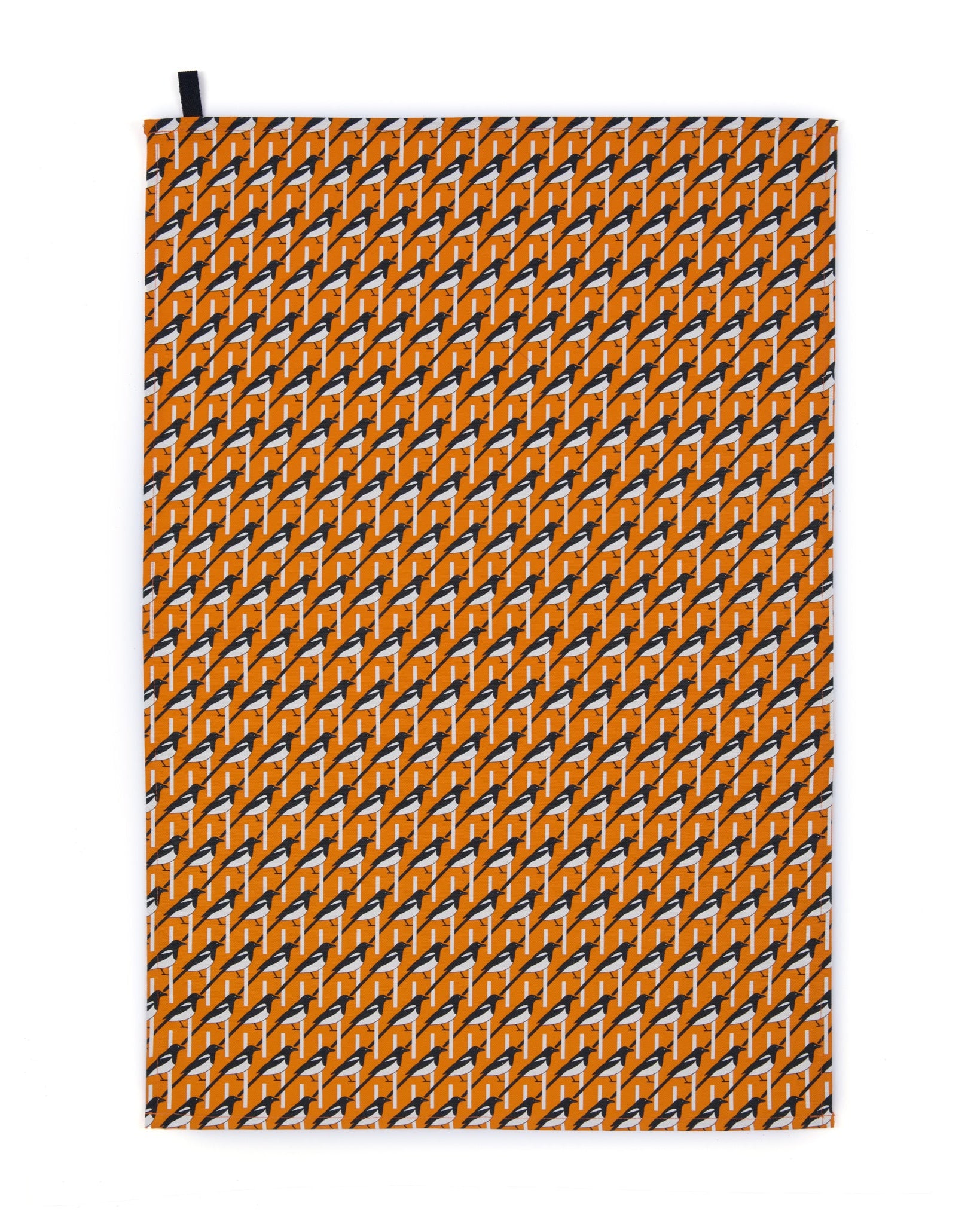 Organic cotton orange magpie tea towel – designed by Hannah Issi and handmade in the UK. Stylish, sustainable kitchen linen. Cut-out image shown with white background.