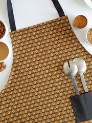 Organic cotton autumn hedgehog apron – designed by Hannah Issi and handmade in the UK. Sustainable, stylish kitchen textile pictured with cooking ingredients