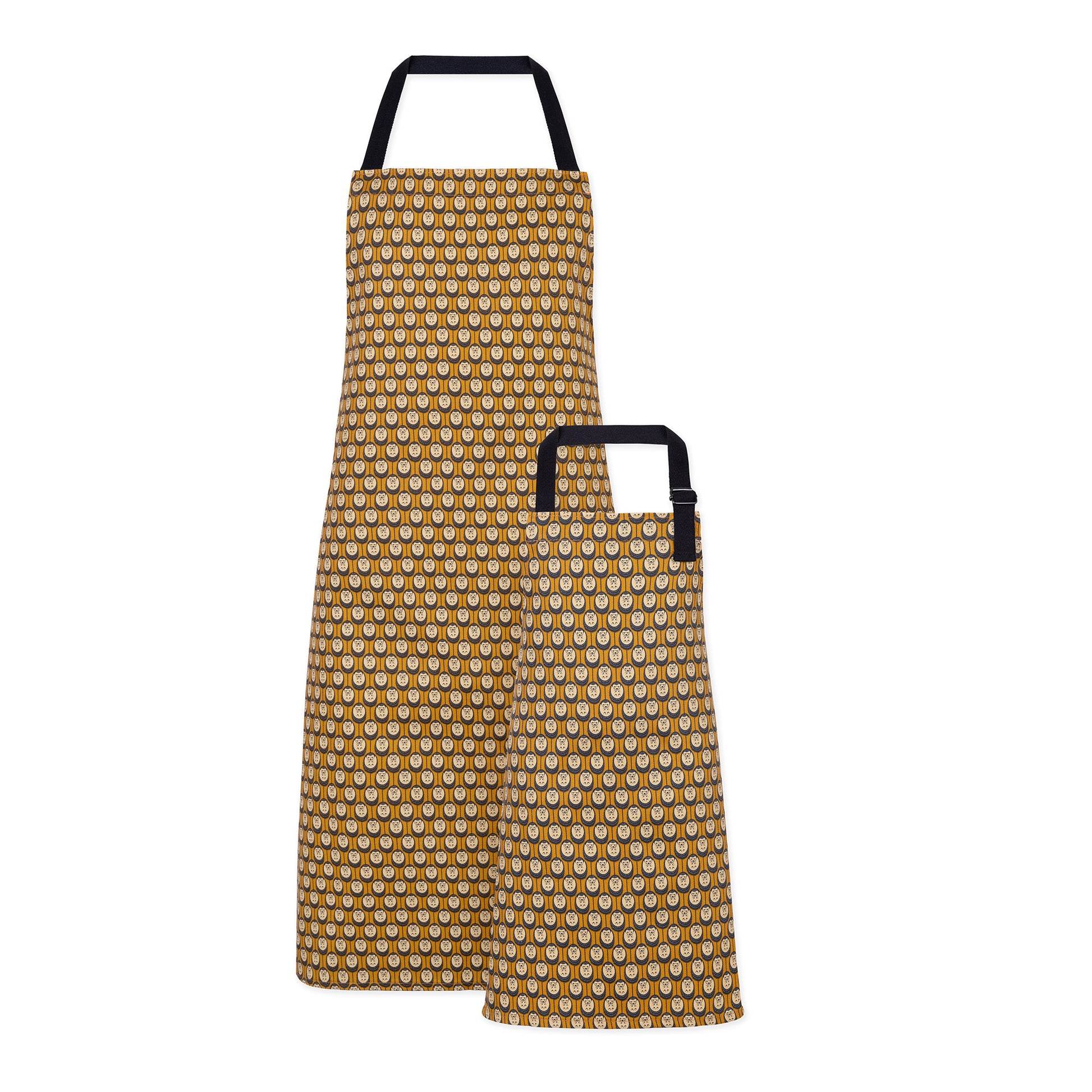Organic cotton autumn hedgehog apron set (adult & child) – handmade in the UK by Hannah Issi. Stylish, sustainable kitchen pair. Cut-out image on white background.