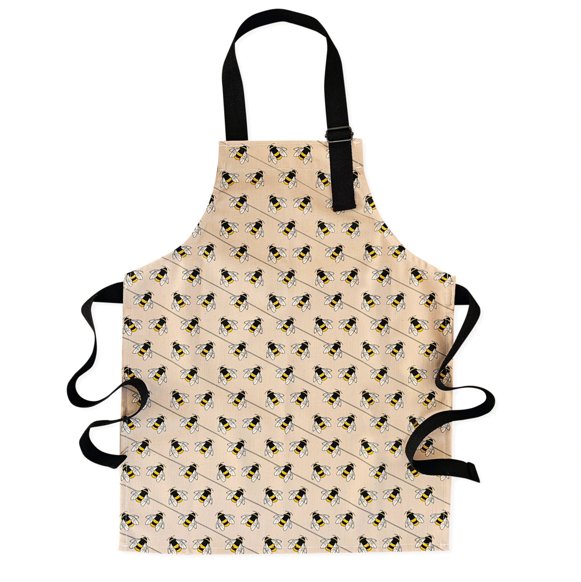 Organic cotton children’s bee apron – handmade in the UK by Hannah Issi. Fun, sustainable kitchen accessory for kids. Cut-out image shown on white background.