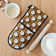 Organic cotton brown & white hedgehog double oven glove – handmade in the UK by Hannah Issi. Stylish, heat-safe kitchen accessory. Lifestyle image with cooking ingredients and rolling pin on wooden tabletop.