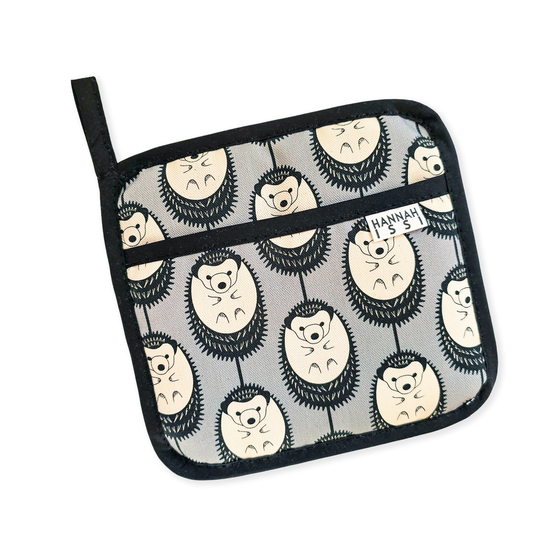 Organic cotton Grey & White Hedgehog pot grab – heat-safe kitchen handle cover by Hannah Issi, handmade in the UK. Stylish and functional. Cut-out image on white background.