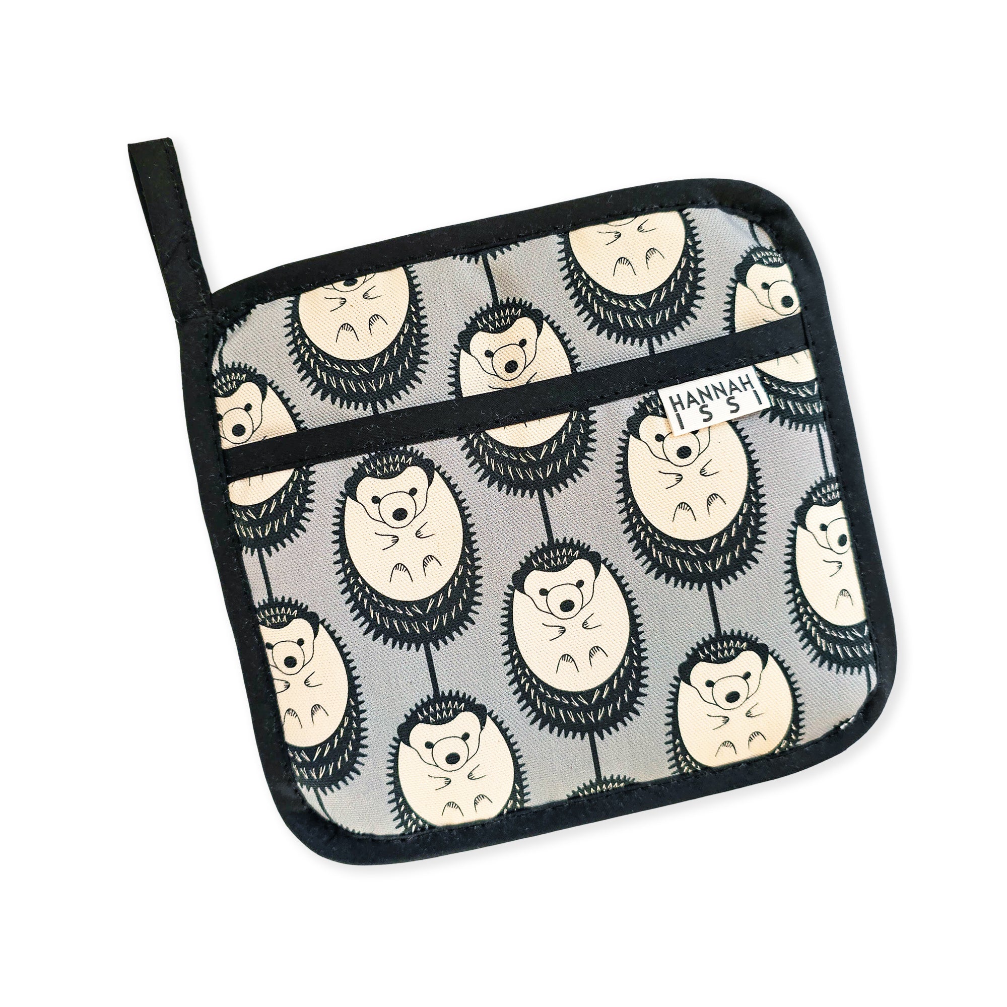 Organic cotton Grey & White Hedgehog pot grab – heat-safe kitchen handle cover by Hannah Issi, handmade in the UK. Stylish and functional. Cut-out image on white background.