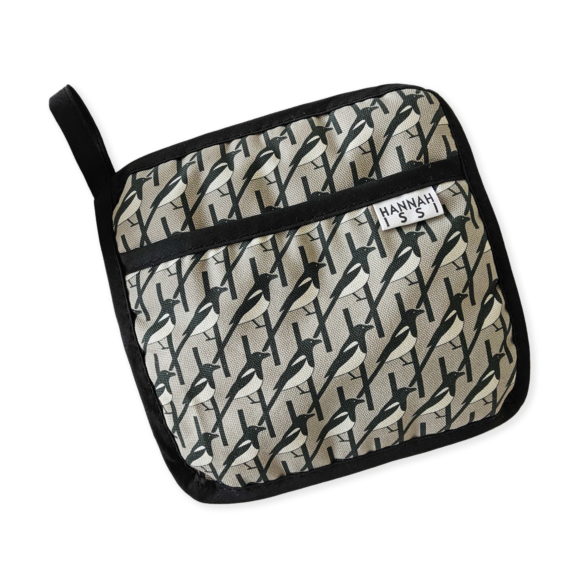 Organic cotton Grey Magpie pot grab – heat-safe kitchen handle cover by Hannah Issi, handmade in the UK. Stylish and functional.