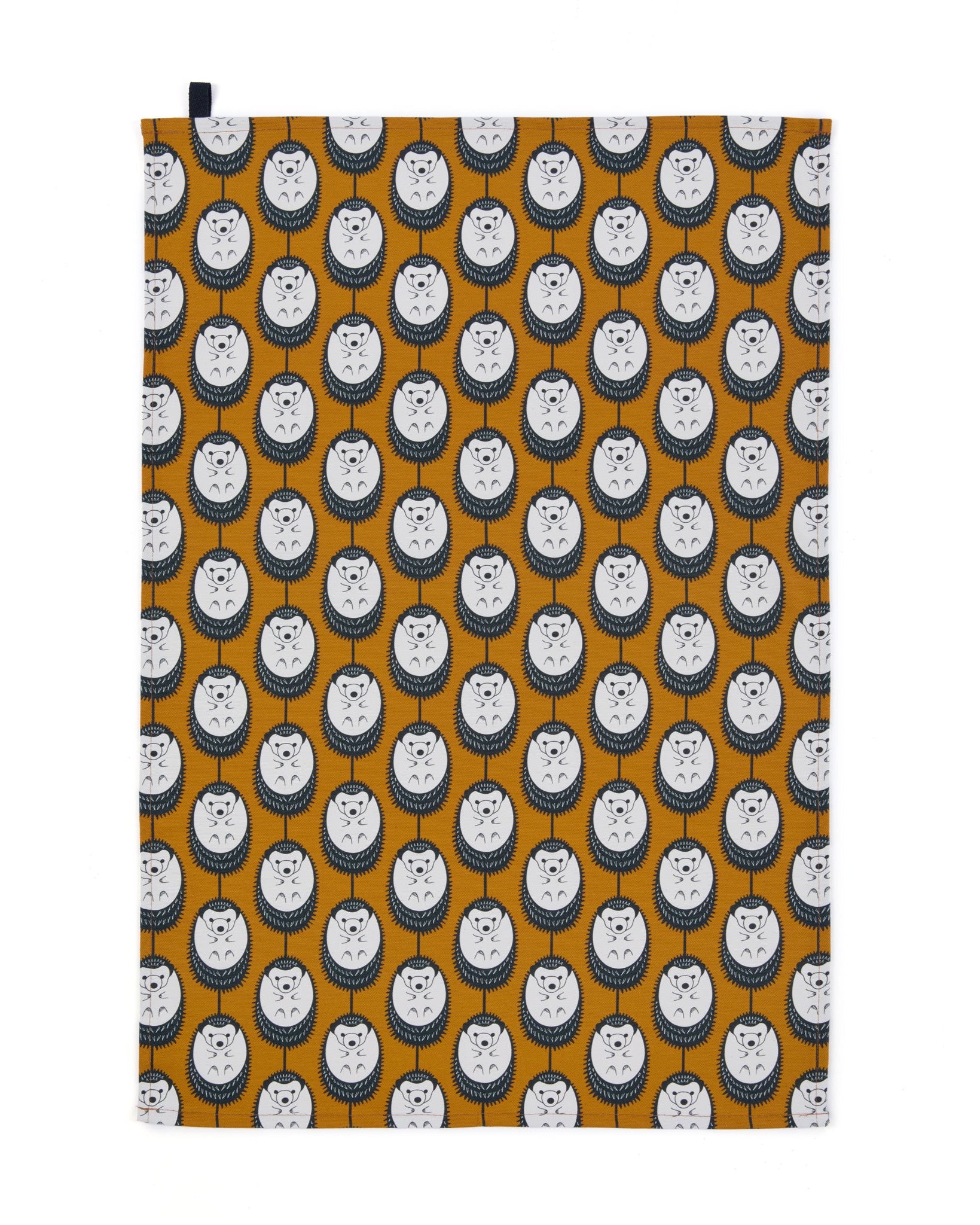 Organic cotton tea towel with brown background and white hedgehog print – designed by Hannah Issi and handmade in the UK. Sustainable, modern and eco-friendly kitchen textile