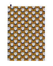 Organic cotton tea towel with brown background and white hedgehog print – designed by Hannah Issi and handmade in the UK. Sustainable, modern and eco-friendly kitchen textile