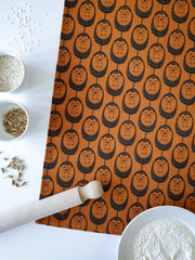 Organic cotton terracotta hedgehog tea towel – designed by Hannah Issi and handmade in the UK. Stylish, sustainable kitchen linen - shown with rolling pin and cooking ingredients. 
